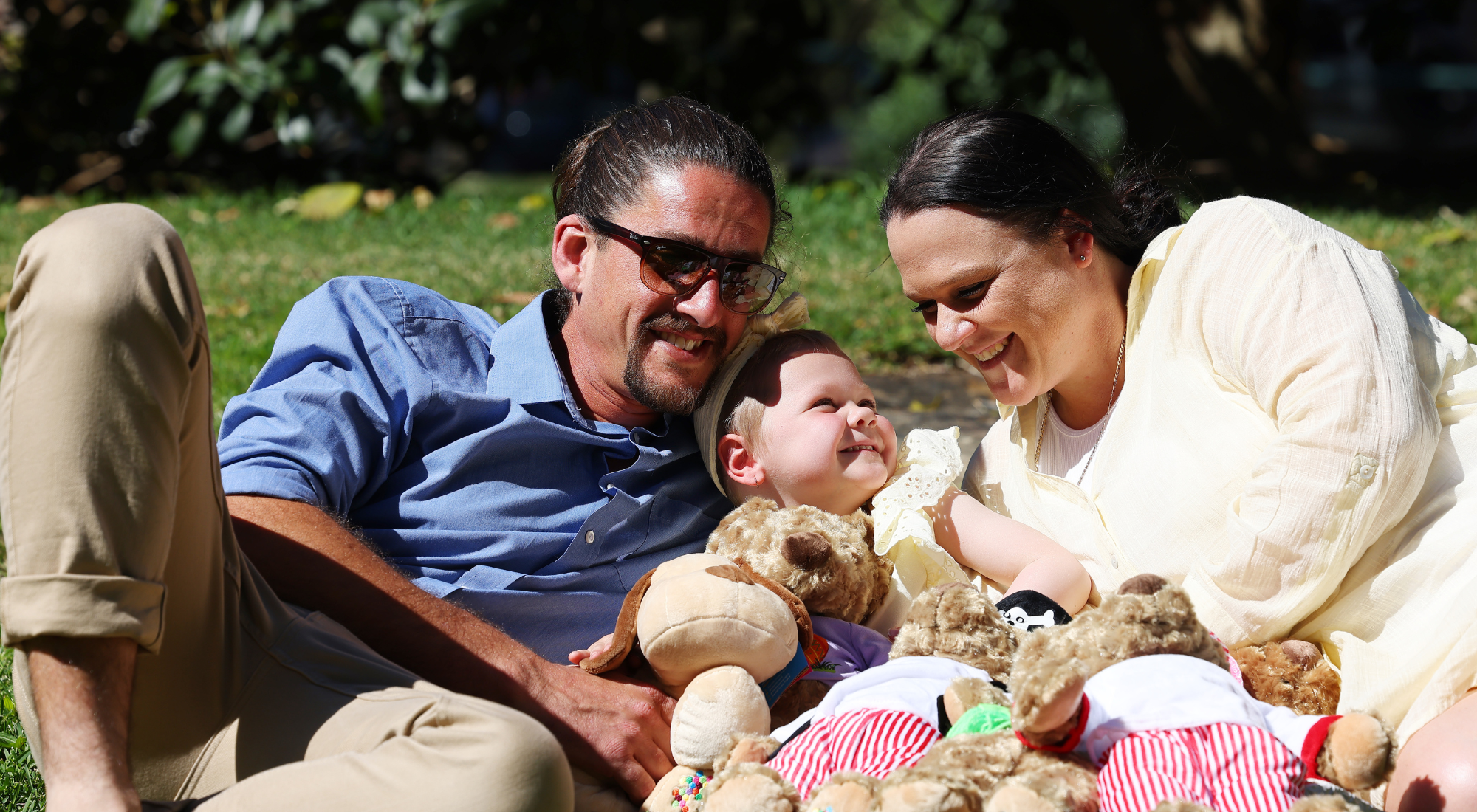 Mileah (centre) with her mum, Kelly, and Kelly’s partner, Mitch and their bears